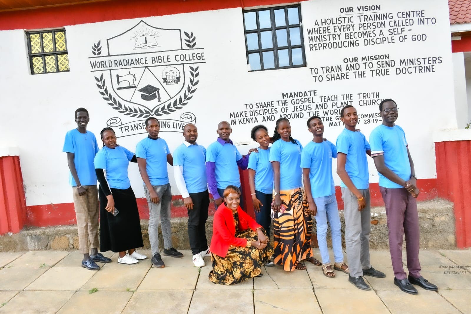 Students in front of the college vision and mission mural
