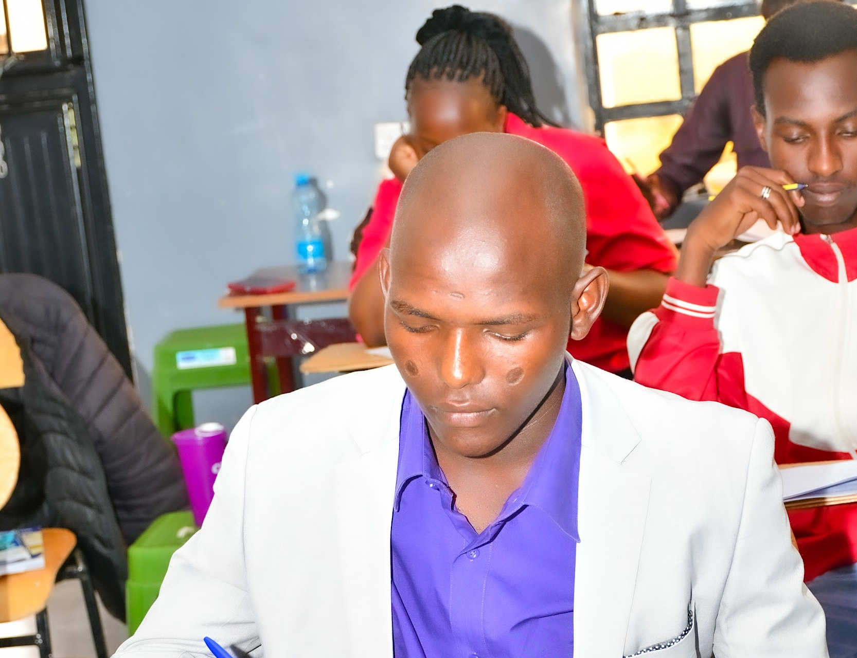 Green double couch with wooden legs